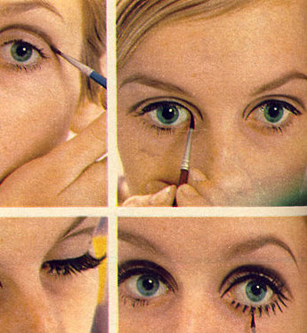 twiggy eye makeup. Model Twiggy putting on eye-
