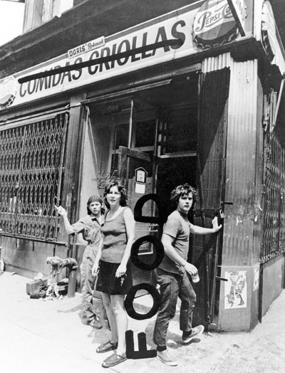 Tina Girouard, Carol Goodden, and Gordon Matta-Clark in front of Food restaurant, Prince Street at Wooster Street, New York, 1971. Photo by Richard Landry, alteration by Gordon Matta-Clark
