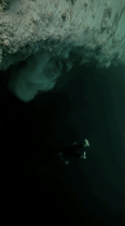 Guillaume Nery base jumps into Deans' Blue Hole