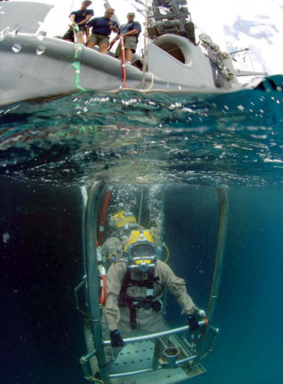 A diver rides a stage to the sea bed from MSC rescue and salvage ship USNS Grasp in St. Kitts during Global Fleet Station 2008. Photo by MCCS Andrew McKaskle