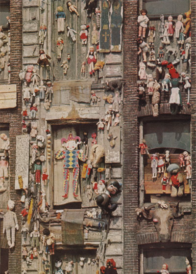 Close-up of dolls decorated Dutch building facade. Photo by Elliot Elisofon