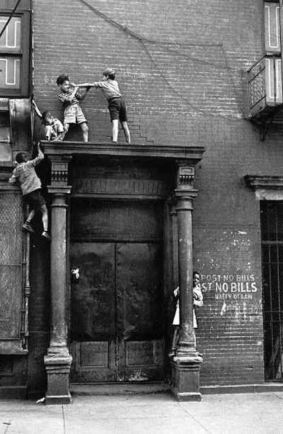 Boys Playing Over Doorway, photo by Helen Levitt