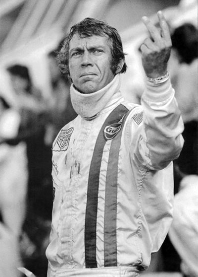 Steve McQueen holds up victory fingers